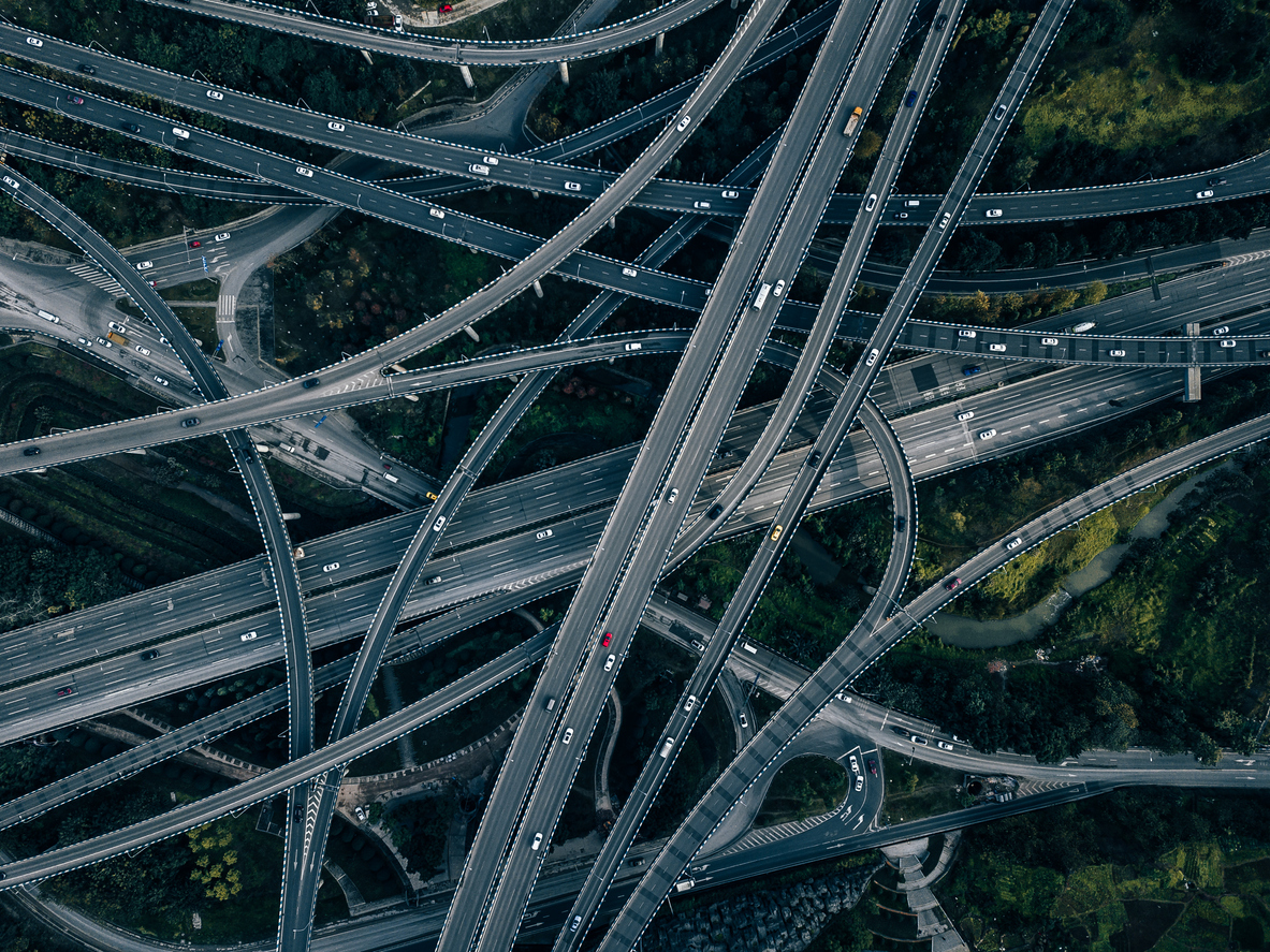 Aerial View of Complex Overpass and Busy Traffic Warehouse-as-a-service